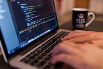 Man typing at on computer